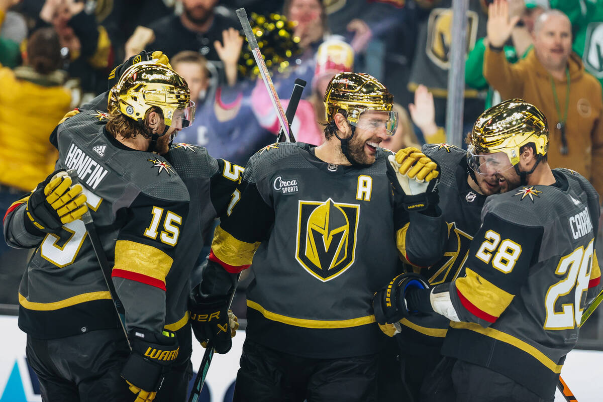 Golden Knights left wing William Carrier (28) celebrates scoring a goal with his teammates duri ...