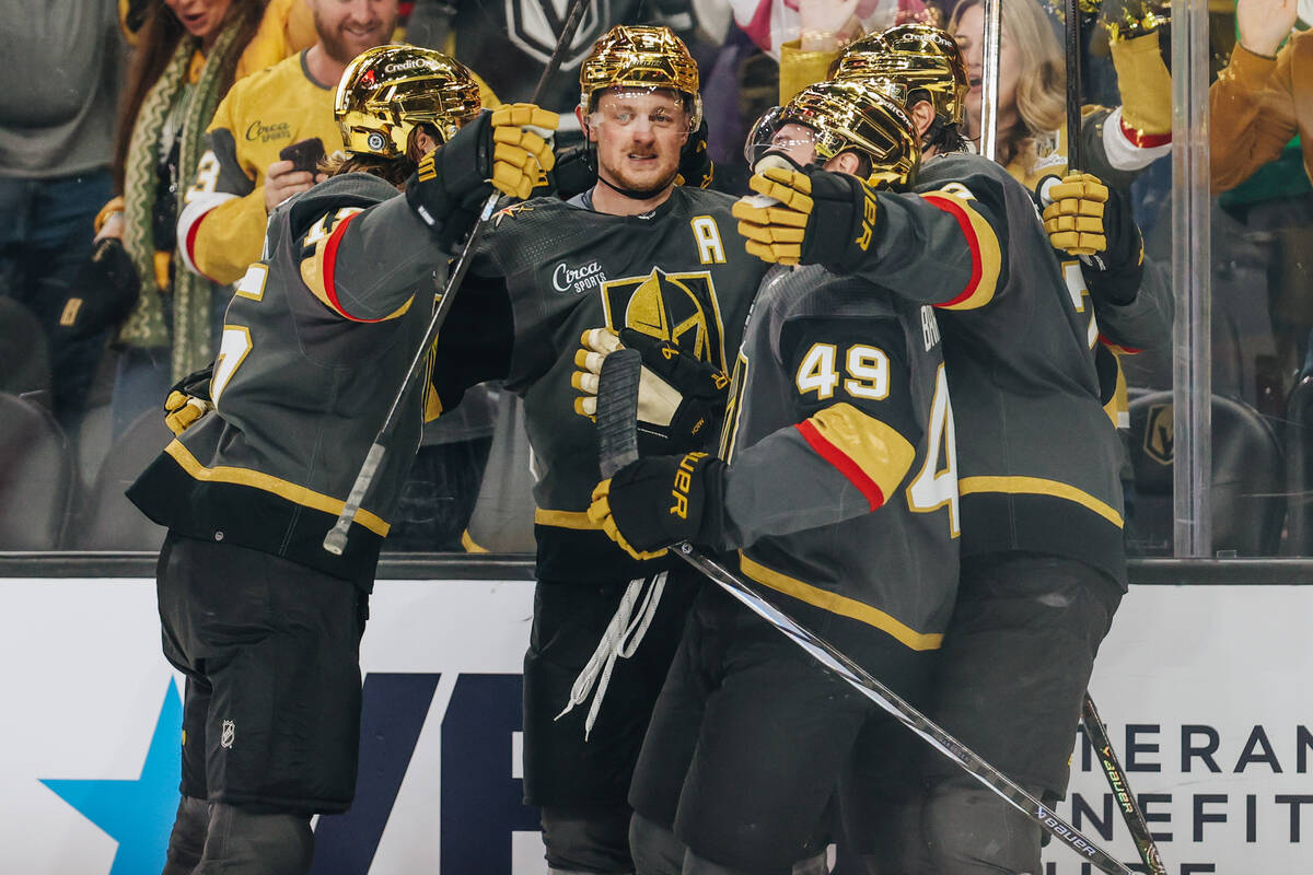 Golden Knights players celebrate a goal made by Golden Knights center Jack Eichel (9) during an ...