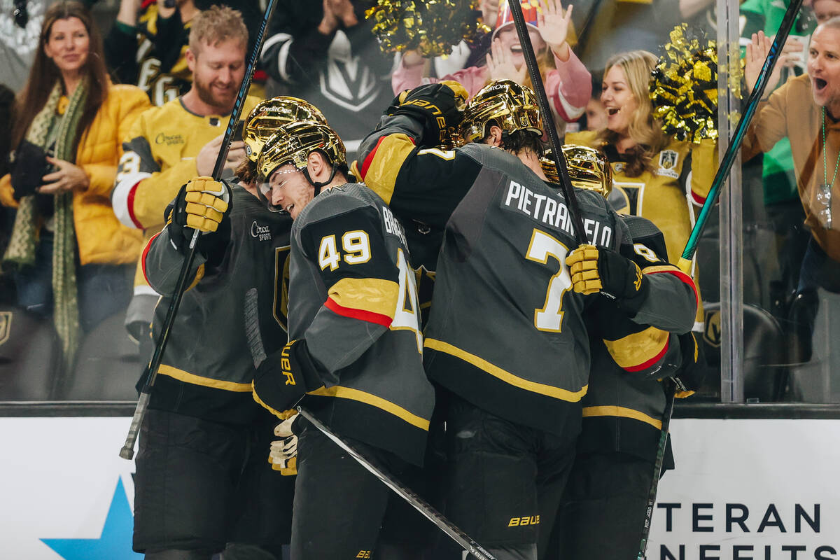 Golden Knights players celebrate a goal made by Golden Knights center Jack Eichel (9) during an ...