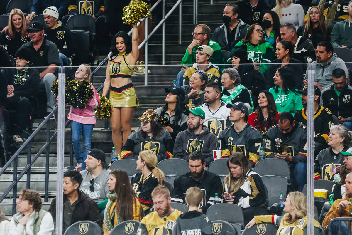 A young fan cheers with a Vegas Viva during an NHL game between the Golden Knights and New Jers ...