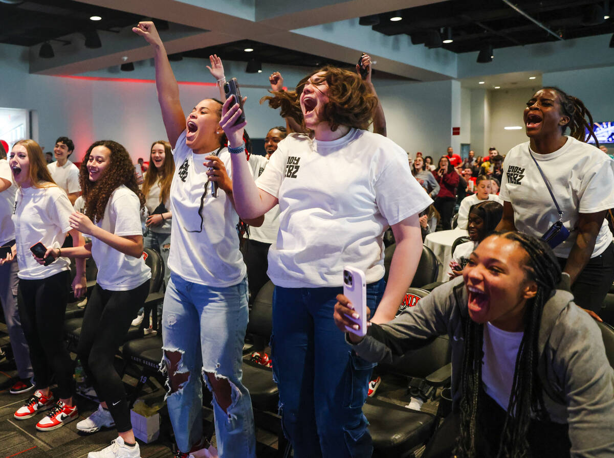 Members of the UNLV Lady Rebels basketball team cheer after their placement was announced in th ...
