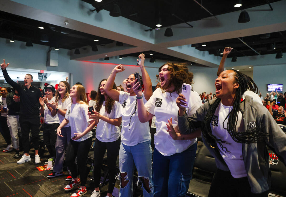 Members of the UNLV Lady Rebels basketball team cheer after their placement was announced in th ...