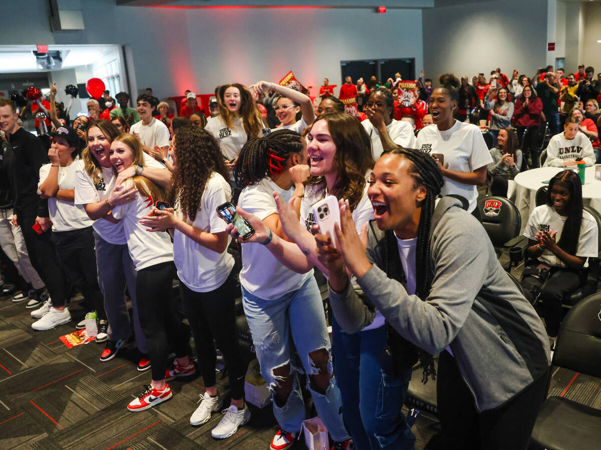 Members of the UNLV Lady Rebels basketball team cheer after their placement was announced in th ...