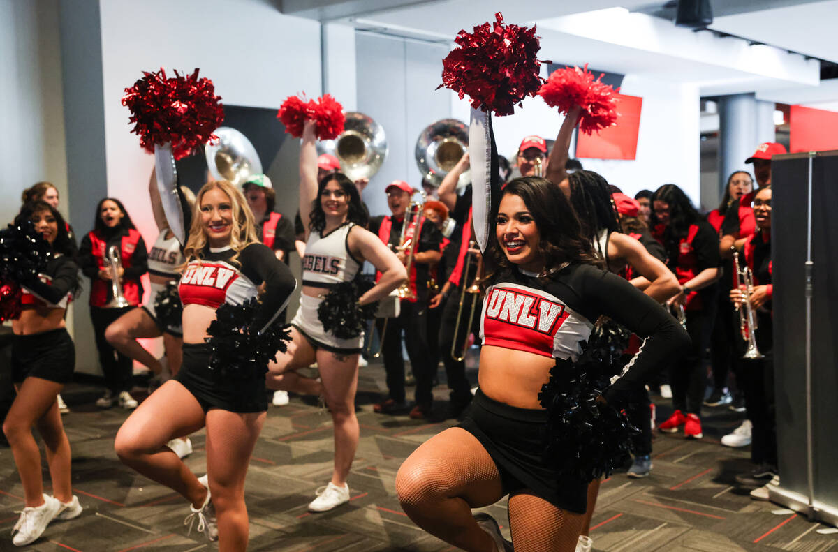 Cheerleaders cheer for the UNLV Lady Rebels basketball team after their placement was announced ...