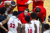 UNLV Rebels head coach Kevin Kruger counsels his players on a timeout against the San Diego Sta ...