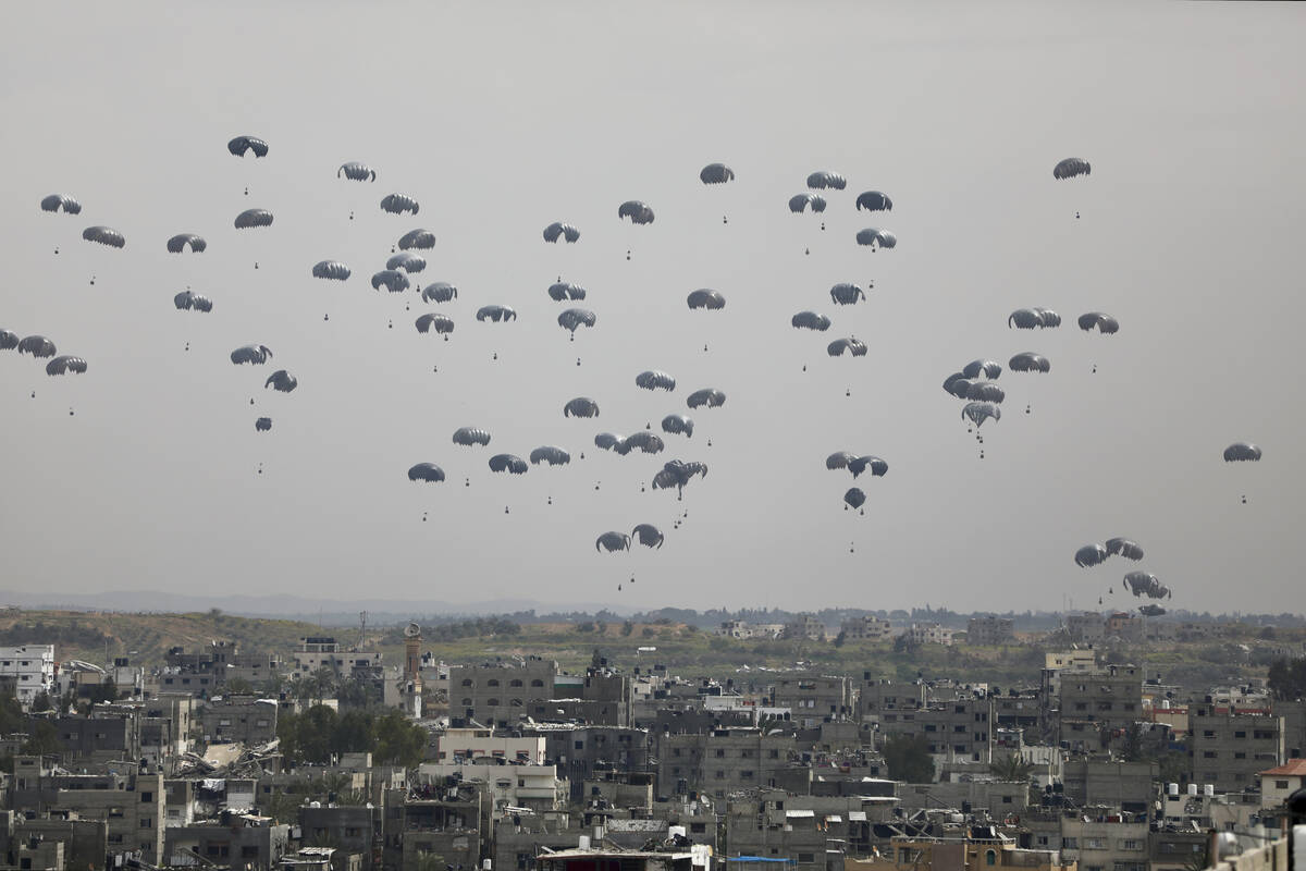 Humanitarian aid is airdropped to Palestinians in Gaza City, Gaza Strip, on Sunday, March 17, 2 ...