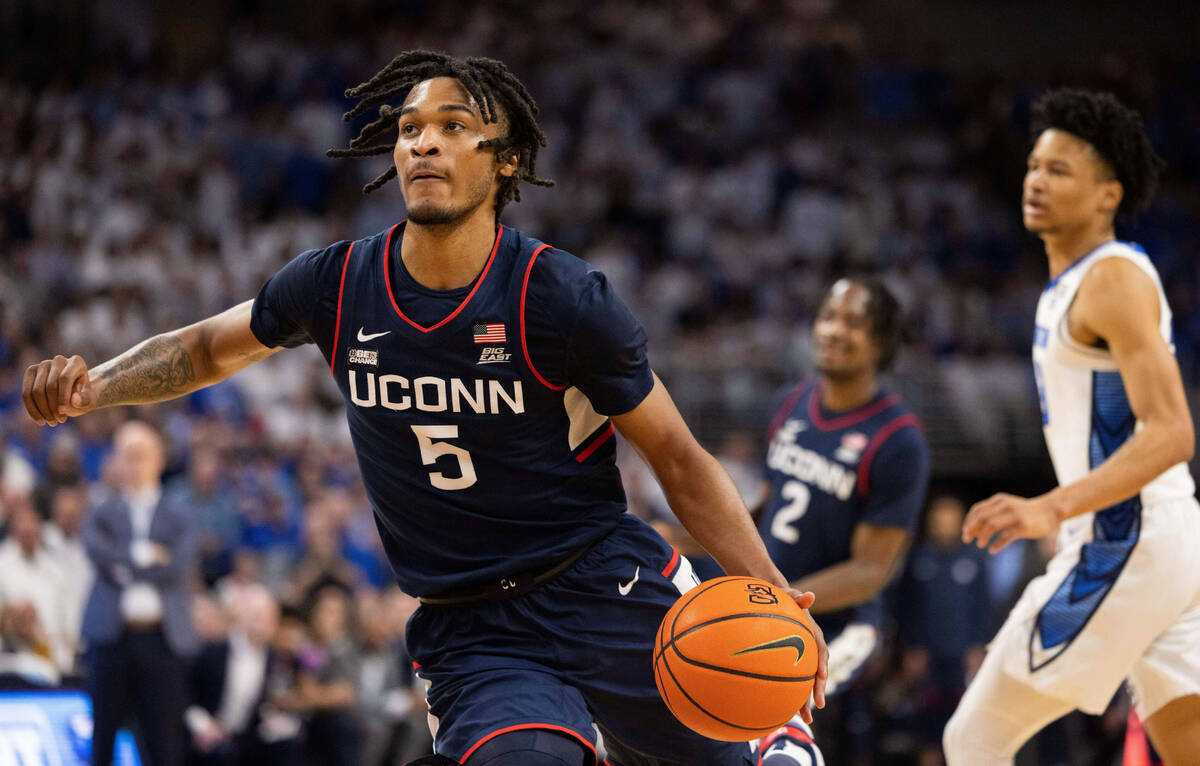 UConn's Stephon Castle (5) plays against Creighton during the first half of an NCAA college bas ...