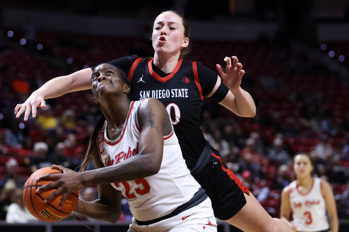 UNLV Lady Rebels center Desi-Rae Young (23) looks for an opening to shoot while San Diego State ...