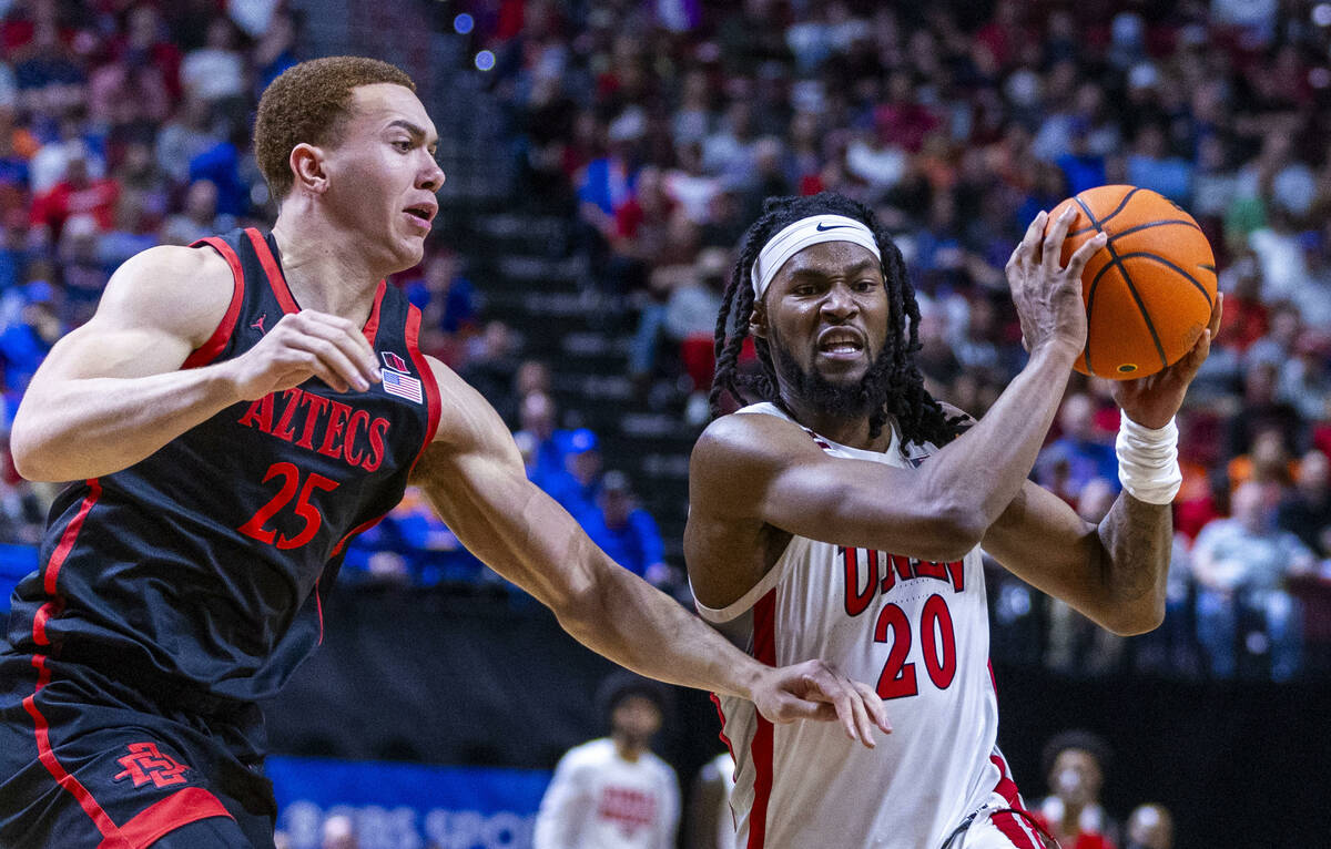 UNLV Rebels forward Keylan Boone (20) battles in the lane against San Diego State Aztecs forwar ...