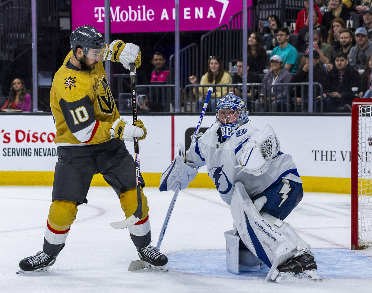 Golden Knights center Nicolas Roy (10) attempts top deflect a puck past Tampa Bay Lightning goa ...