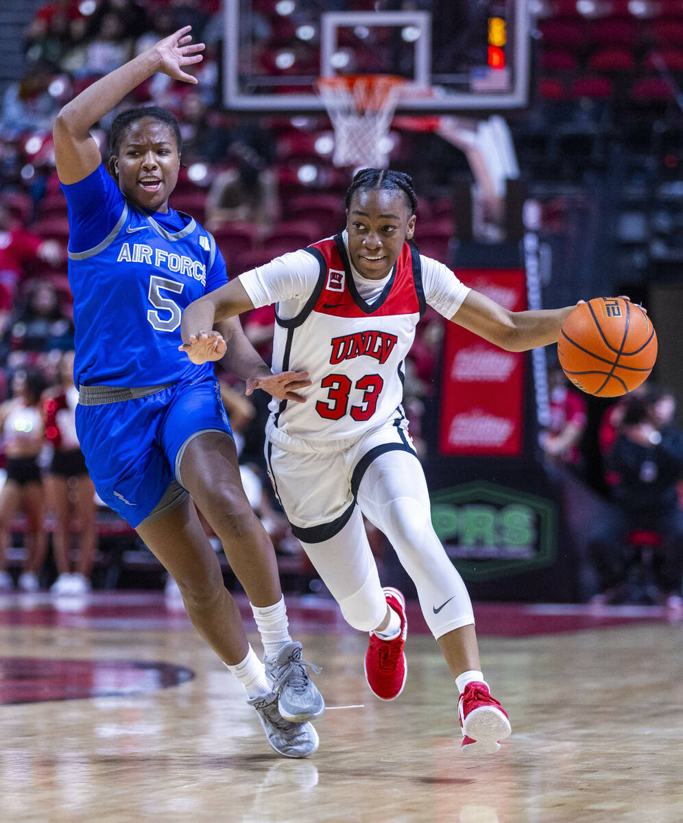 UNLV Lady Rebels guard Amarachi Kimpson (33) drives the court against Air Force Falcons guard T ...