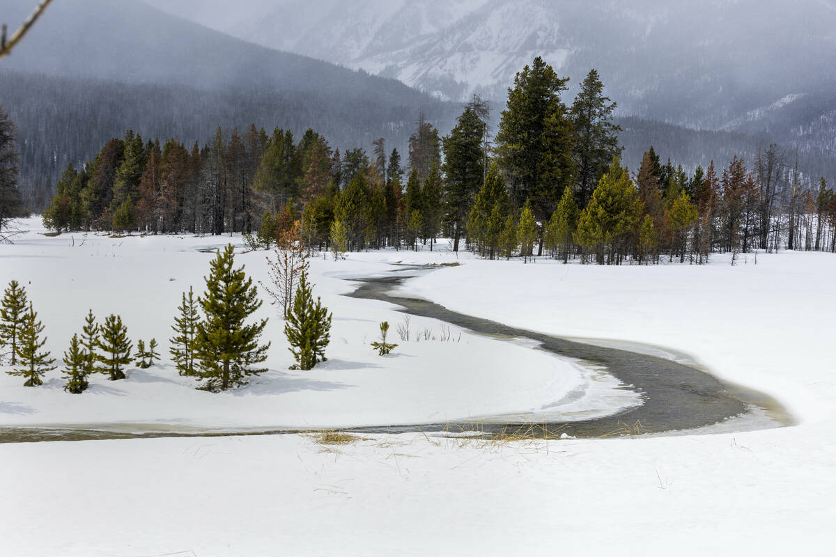 Snow continues to fall as the Colorado River at its headwaters is still partly under snow and i ...