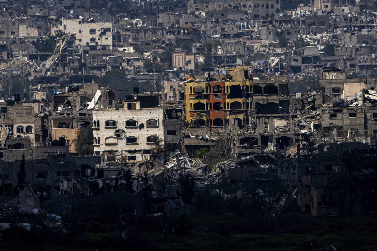 Destroyed buildings stand inside the Gaza Strip, as seen from southern Israel, Tuesday, March 1 ...