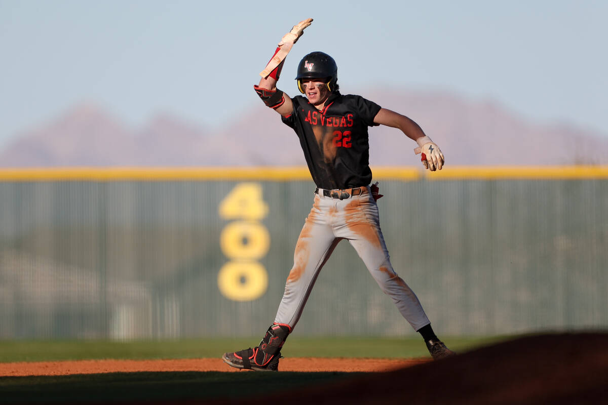 Las Vegas’ Bryden Bull (22) celebrates after hitting a double during a high school baseb ...