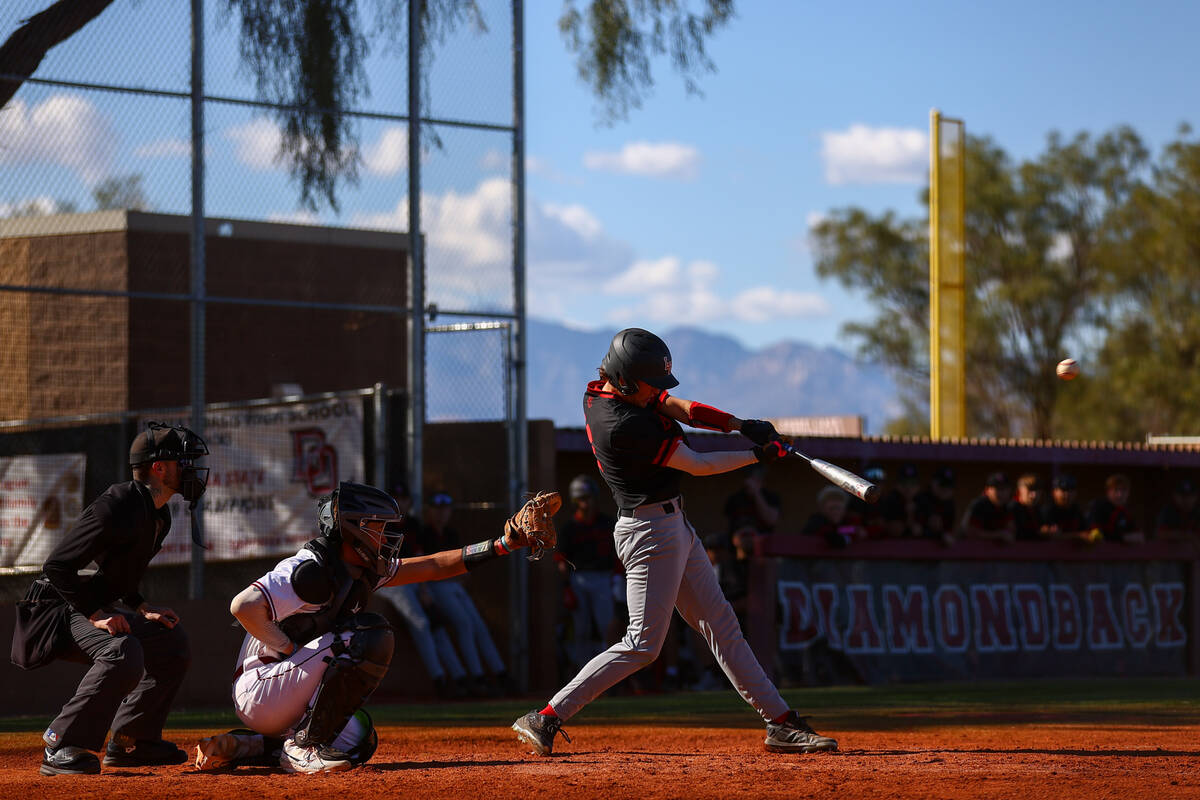 Las Vegas’ Carter Francom bats gets a hit on Desert Oasis during a high school baseball ...