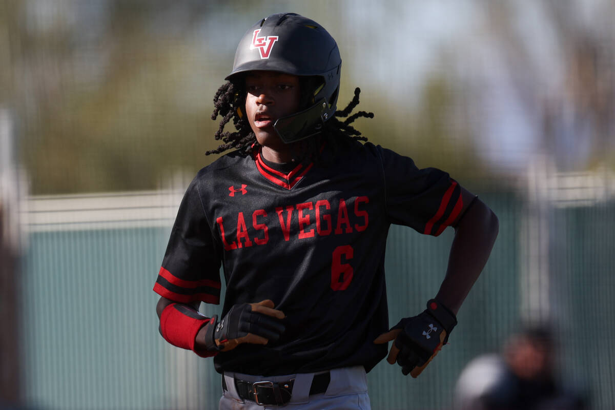 Las Vegas’ Keisean Ellzy runs to home plate during a high school baseball game against D ...
