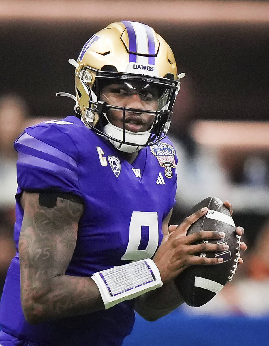 Washington quarterback Michael Penix Jr. looks to pass during the second half of the Sugar Bowl ...