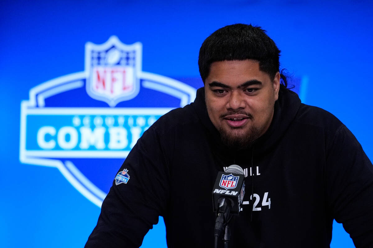Oregon State offensive lineman Taliese Fuaga speaks during a press conference at the NFL footba ...