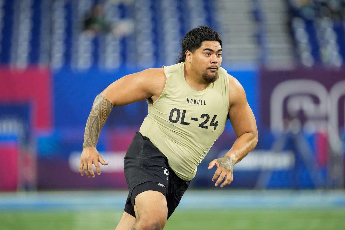 Oregon State offensive lineman Taliese Fuaga runs a drill at the NFL football scouting combine, ...