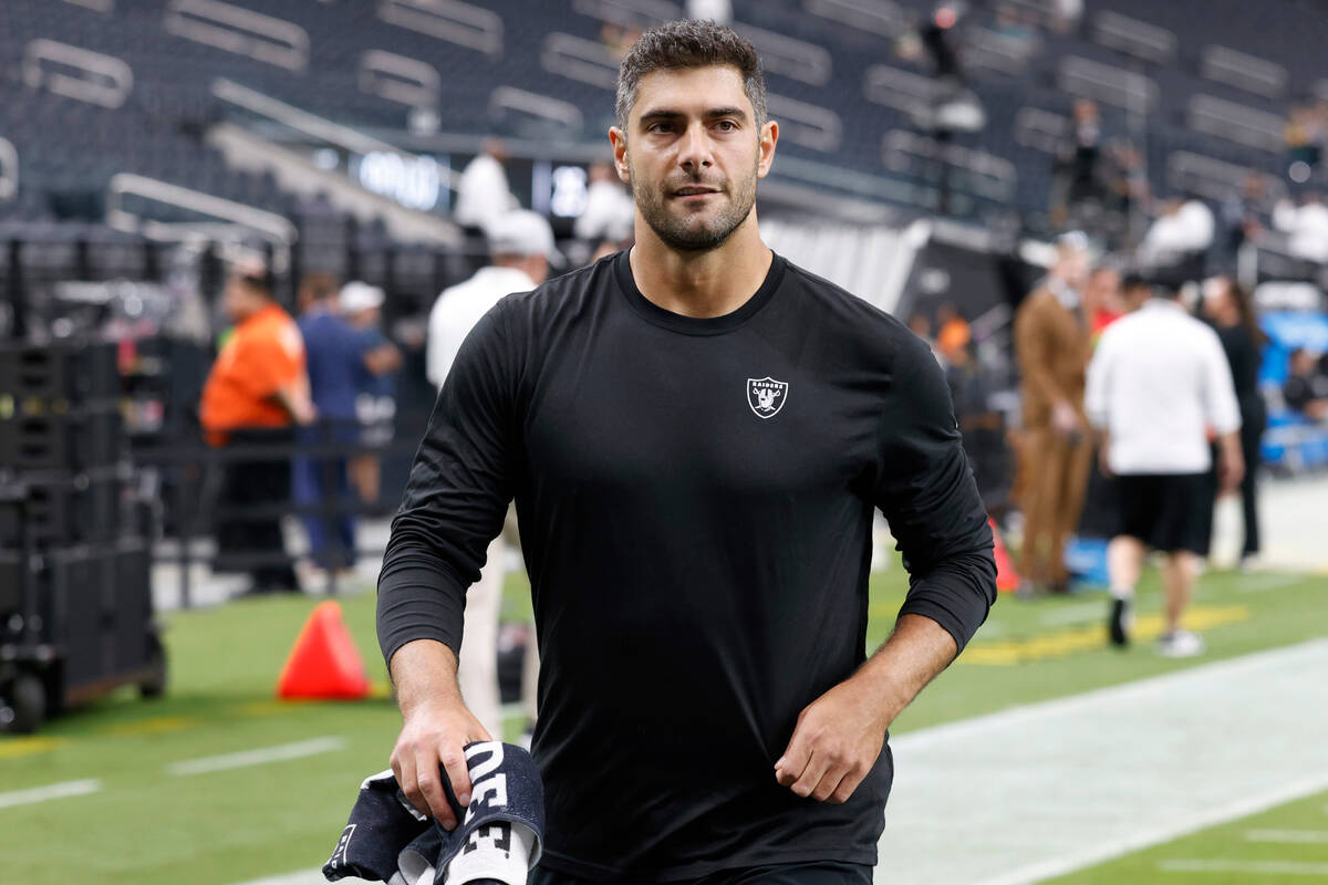 Raiders quarterback Jimmy Garoppolo (10) walks off the field after warming up prior to the star ...