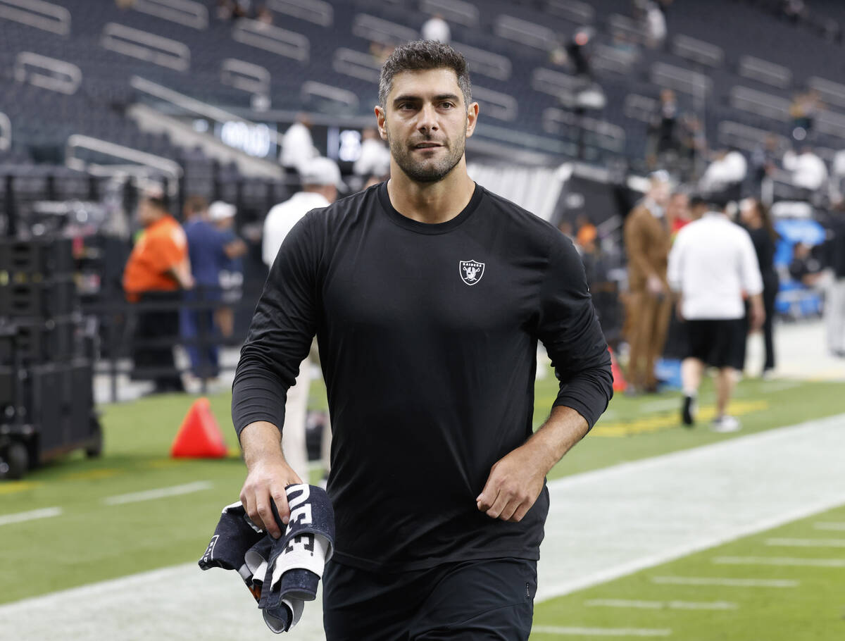 Raiders quarterback Jimmy Garoppolo (10) walks off the field after warming up prior to the star ...