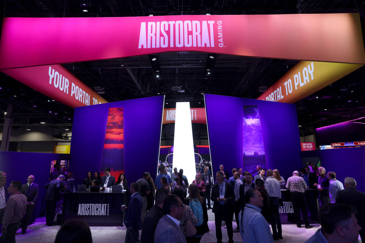 Customers in the Aristocrat Gaming booth at the Global Gaming Expo (G2E) at The Venetian Expo i ...