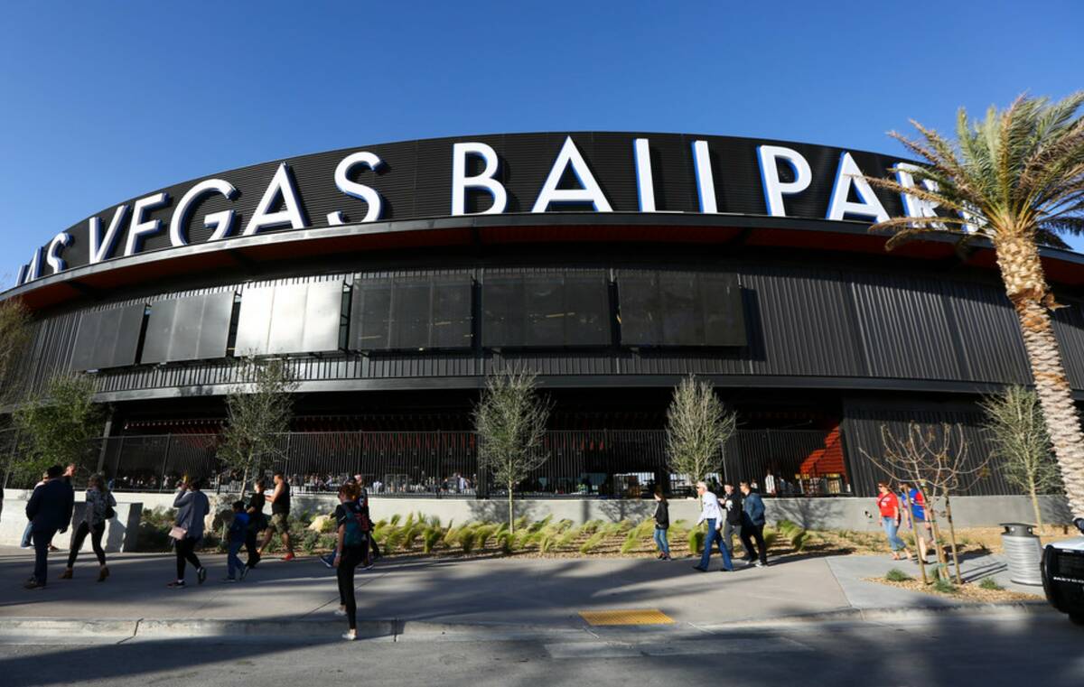 Fans line up to enter the Las Vegas Ballpark for the Las Vegas Aviators' home opener in Downtow ...