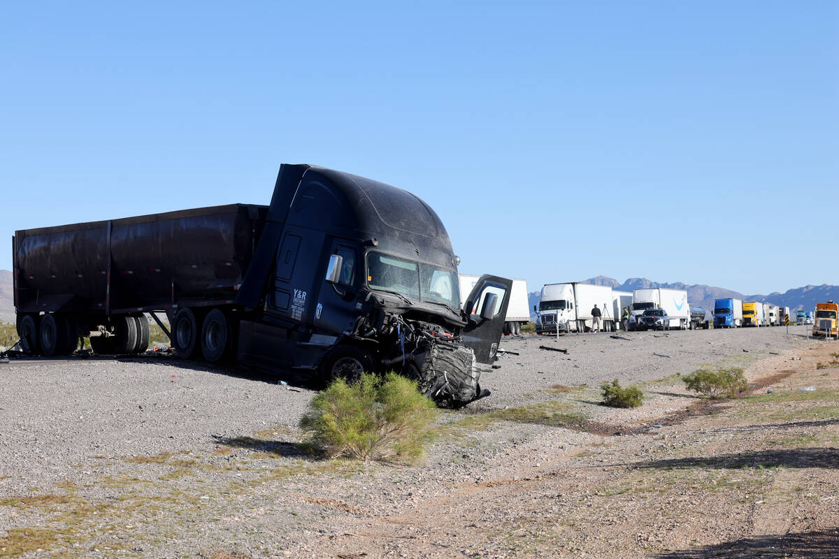 the Nevada Highway Patrol investigates a fatal crash involving a semi-truck and a passenger car ...