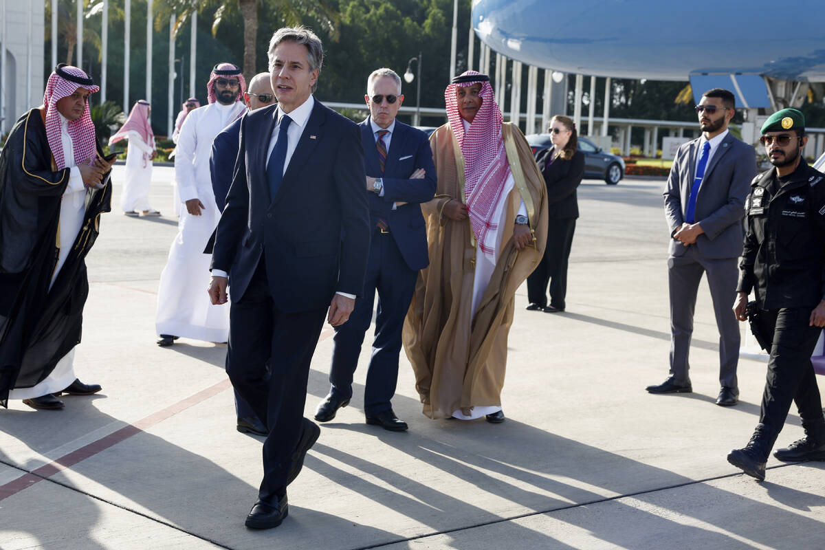 U.S. Secretary of State Antony Blinken walks as he arrives in Jeddah, Saudi Arabia, Wednesday, ...