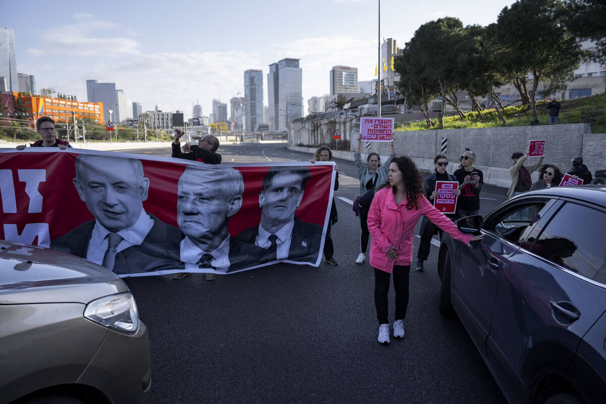 Activists block a highway as they demand the release of the hostages from Hamas captivity in th ...