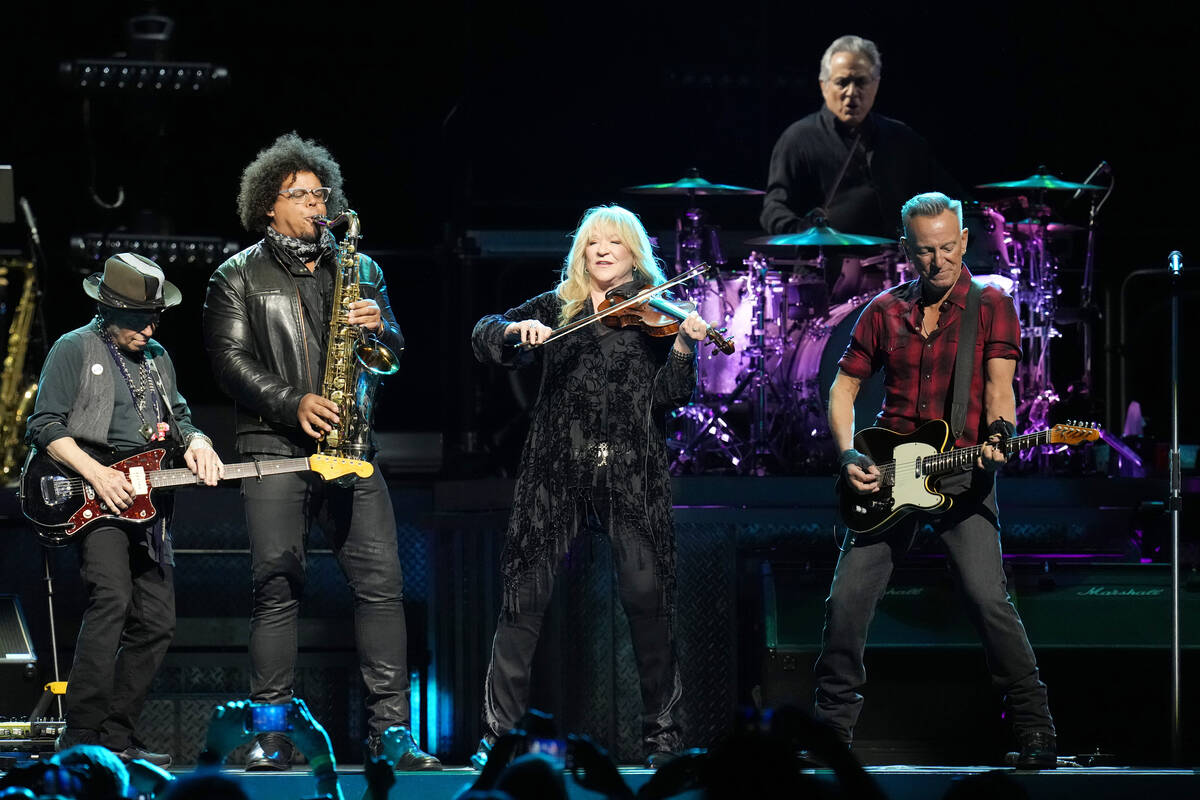 Bruce Springsteen, right, is joined by guitarist Nils Lofgren, left, Jake Clemons second from l ...