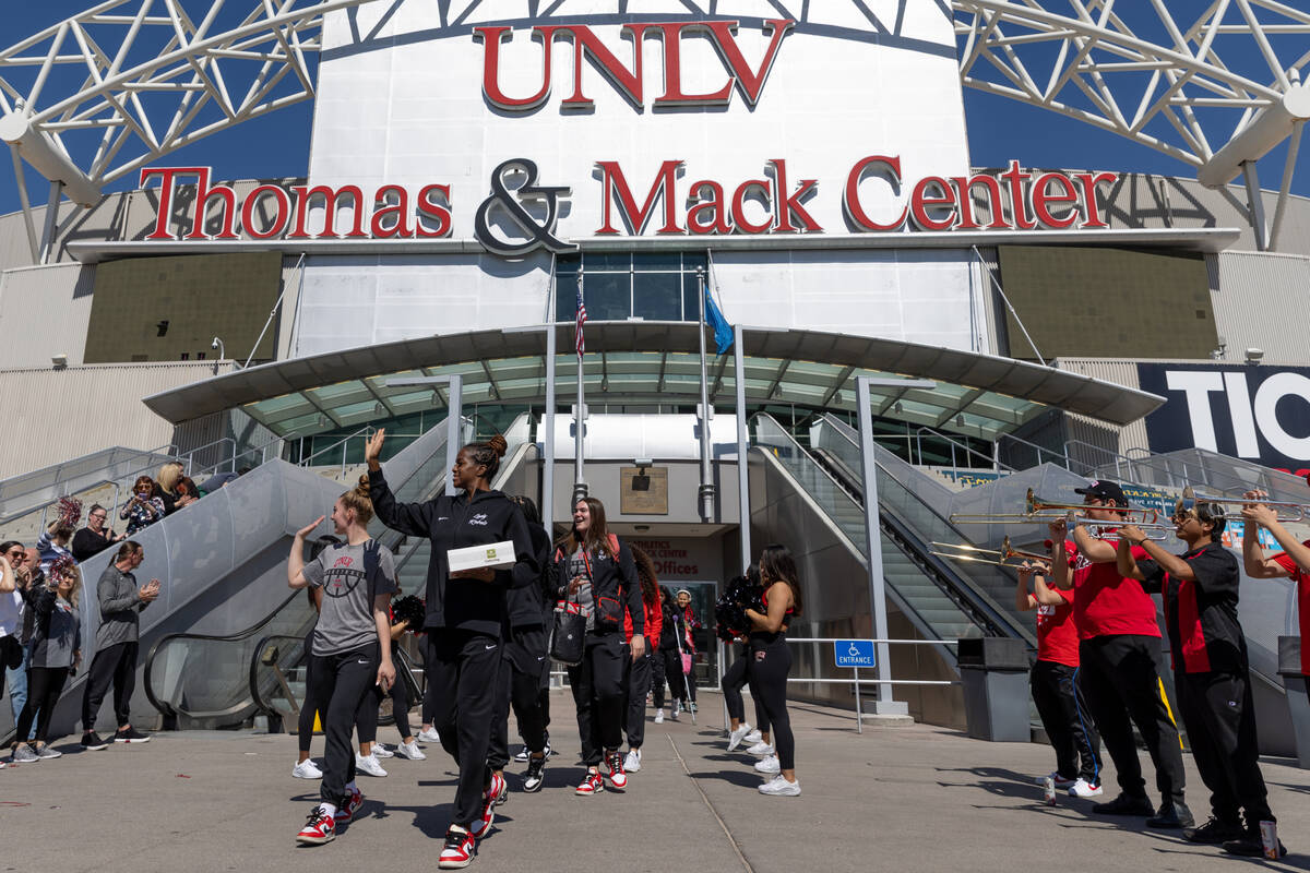 The UNLV Lady Rebels walk out of the Thomas & Mack Center to board a bus to Los Angeles bef ...
