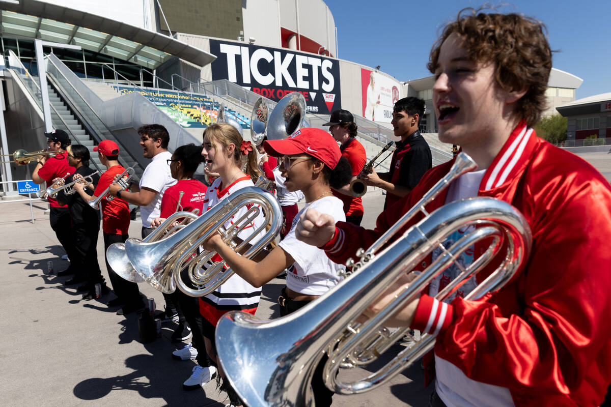 The UNLV marching band plays as the Lady Rebels board a bus to Los Angeles before they compete ...