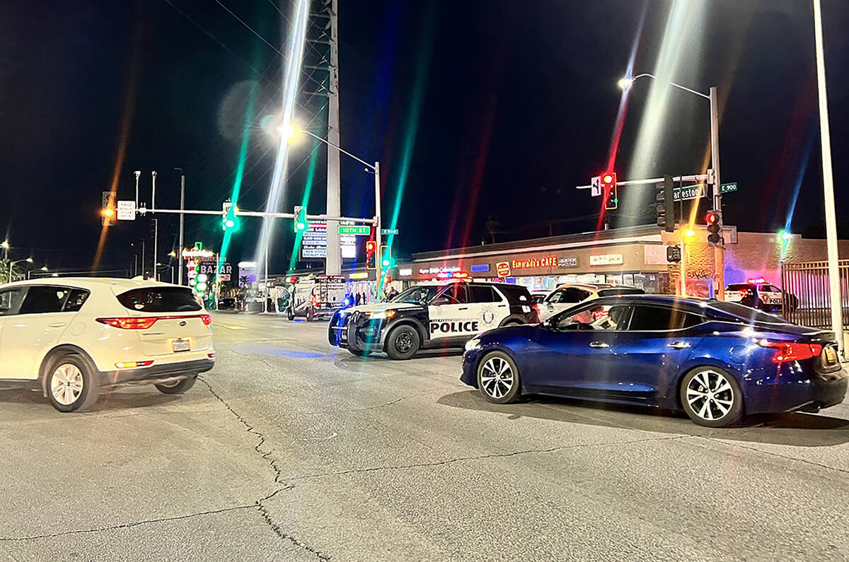 Metropolitan Police Department officers investigate a fatal auto-pedestrian collision on Tuesda ...