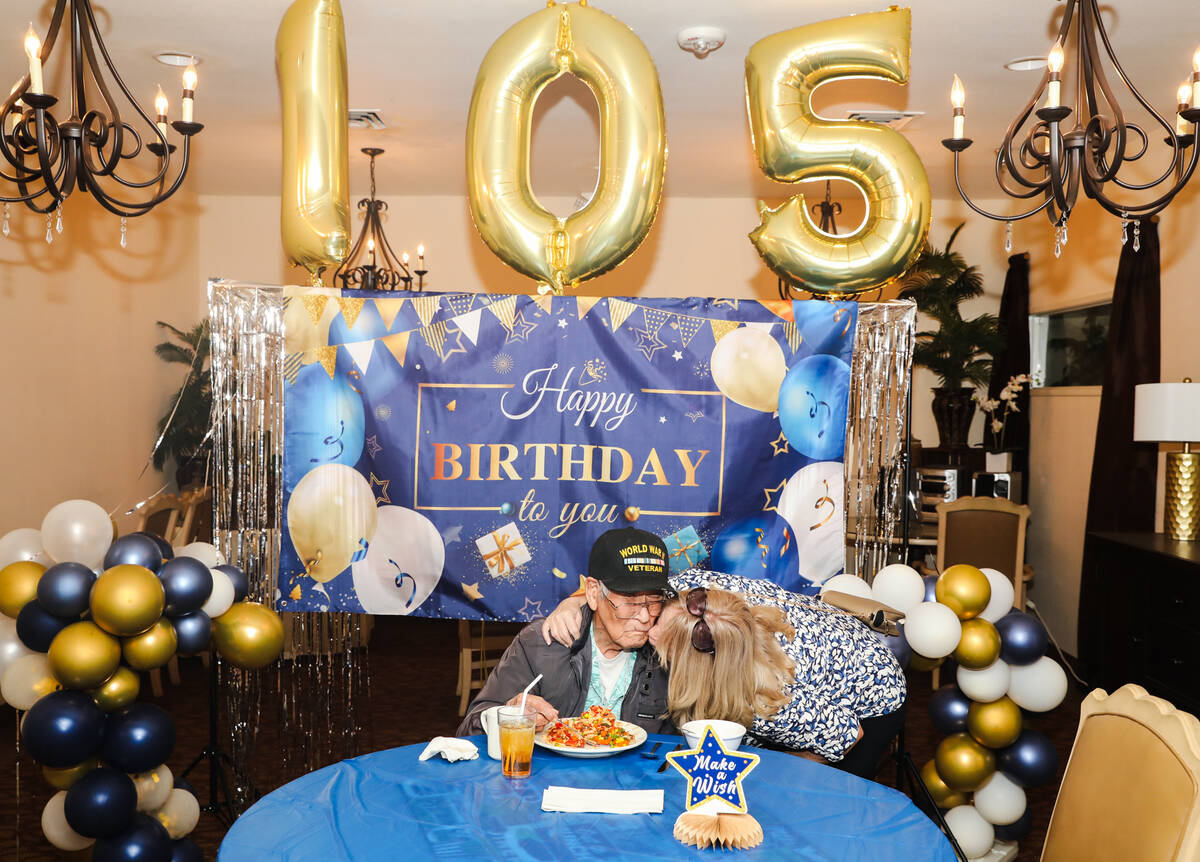 Roy Hashimura, a WW2 veteran, is greeted by his daughter-in-law Tracee Hashimura at his 105th b ...