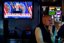 A trader works on the floor of the New York Stock Exchange Wednesday, March 20, 2024. (AP Photo ...