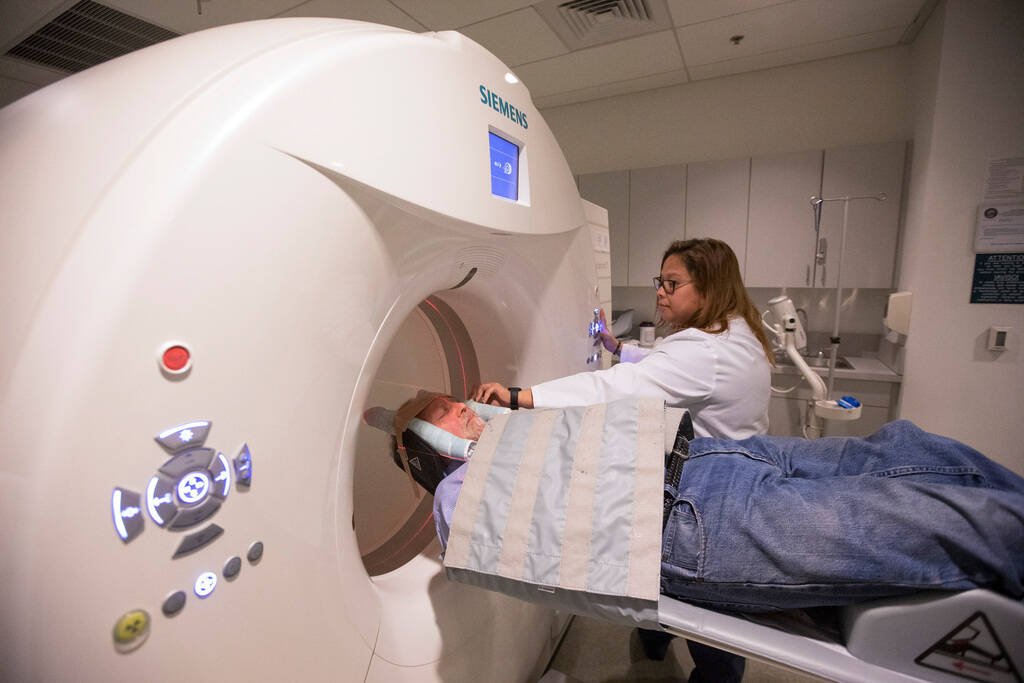 Nuclear Medicine Technologists Vanessa Martinez prepares to conduct the GE 180 scan on Las Vega ...