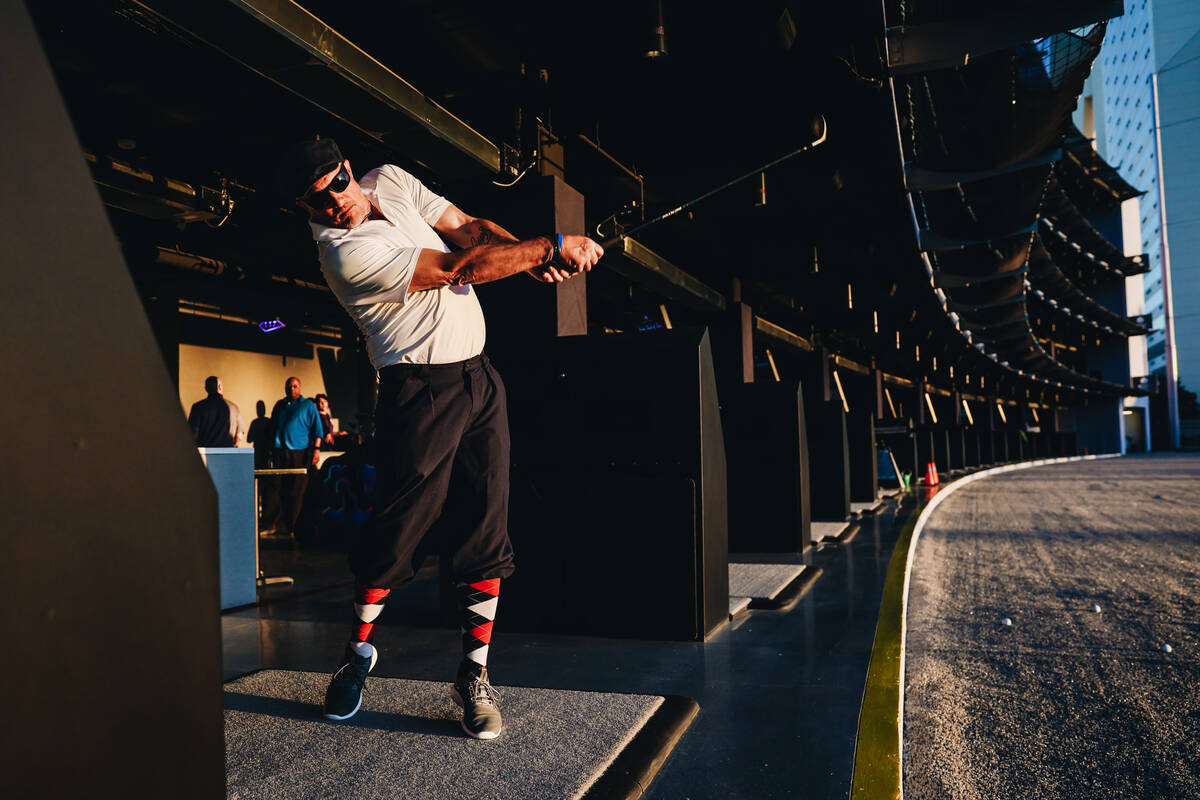 A golfer tries out the bays at Atomic Golf on Wednesday, March 20, 2024, in Las Vegas. (Madelin ...