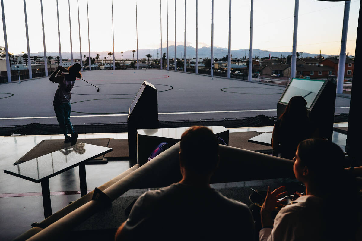 Golfers try out the bays at Atomic Golf on Wednesday, March 20, 2024, in Las Vegas. (Madeline C ...