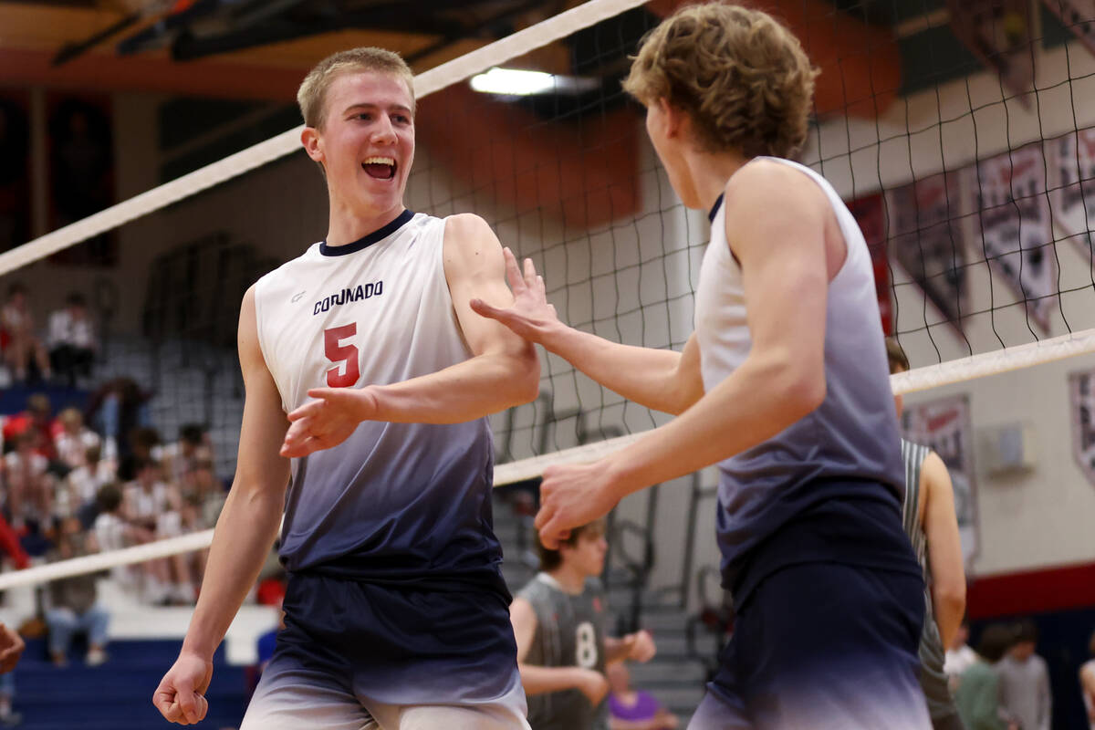 Coronado outside hitter Dexter Brimhall (5) celebrates a point with setter Braxton Rowley, righ ...