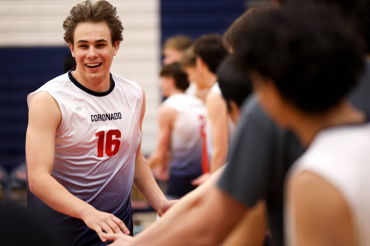 Coronado’s Luke Wilkinson high fives his teammates as he is announced in the starting li ...