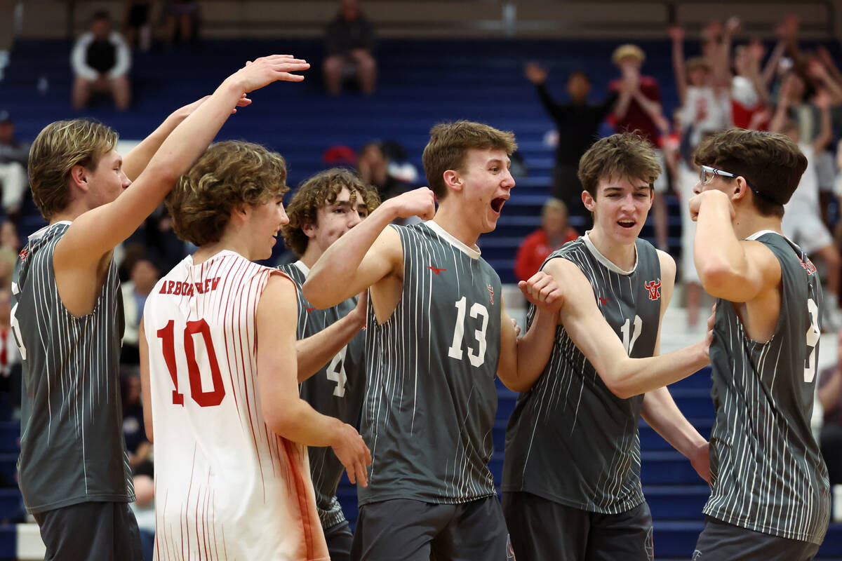 Arbor View celebrates a point during a boys high school volleyball match against Coronado at Co ...