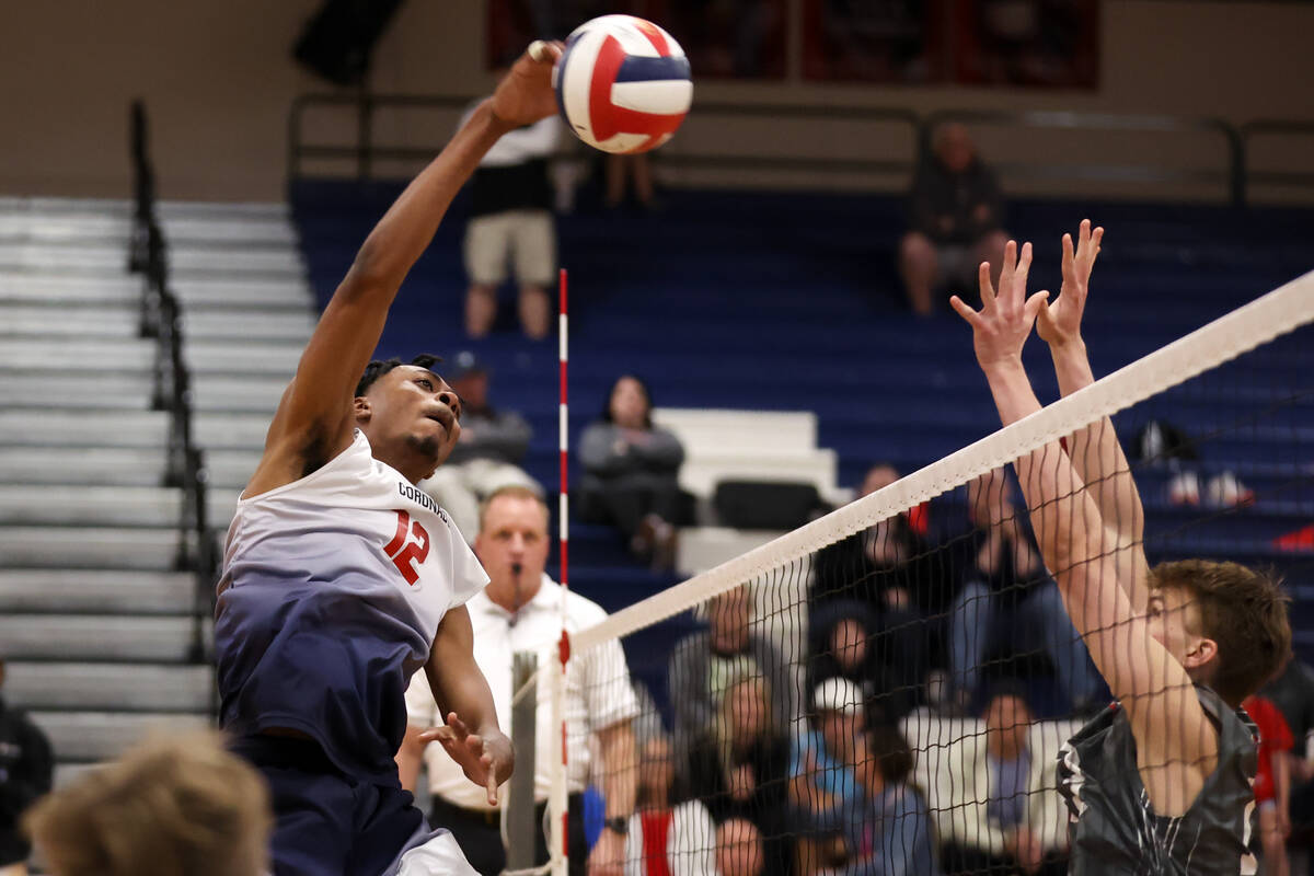 Coronado middle blocker Jayden Bell hits against Arbor View during a boys high school volleybal ...