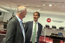 Oakland Athletics President Dave Kaval, right, talks with LVCVA CEO Steve Hill before the Aug. ...