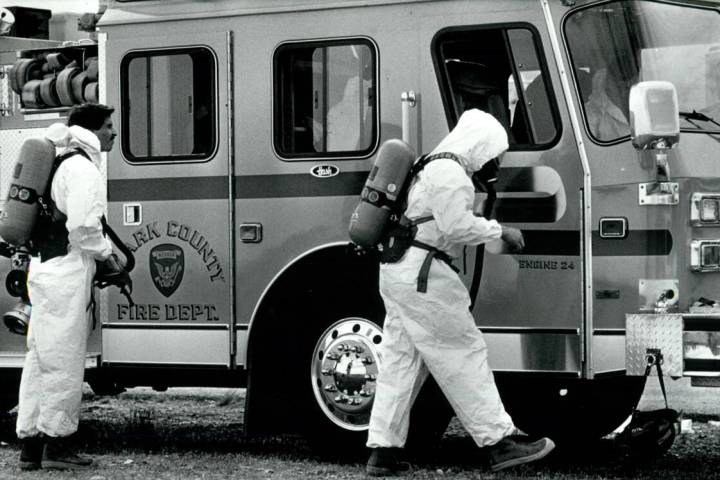 Firefighters don protective gear at the Pioneer Chlor Alkali leak on May 6, 1991, in Henderson. ...