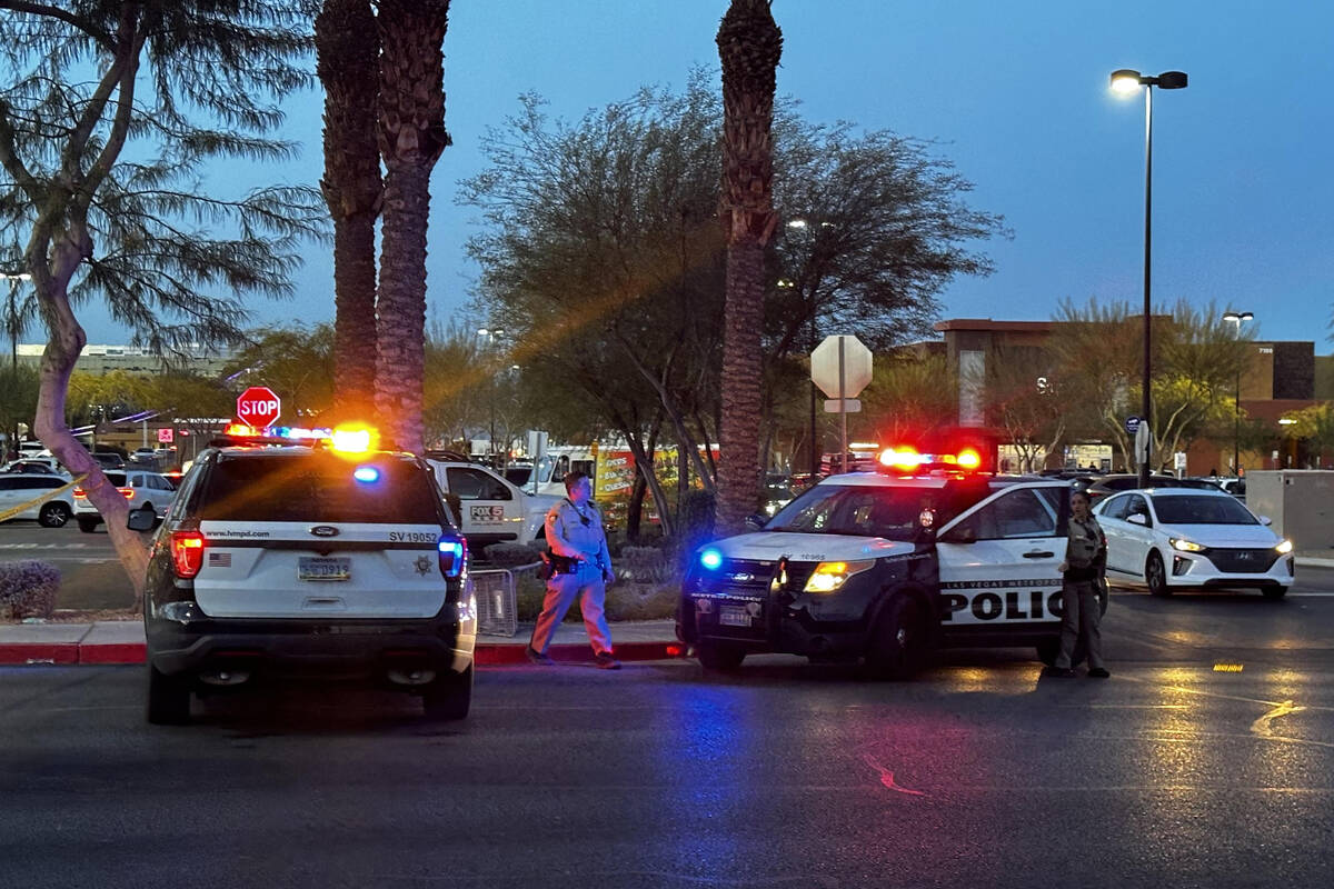 Police investigate a fatal shooting scene near Walmart at 7200 block of Arroyo Crossing Parkway ...