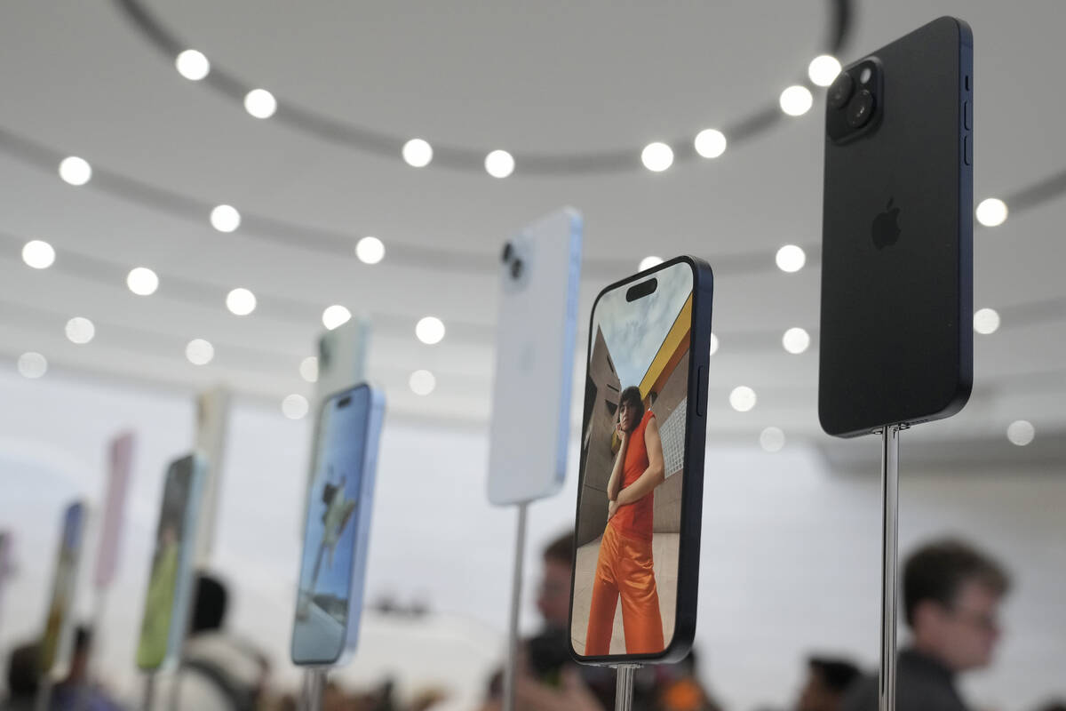 FILE - iPhone 15 phones are shown during an announcement of new products on the Apple campus in ...