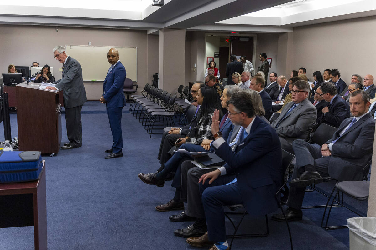 Bally's Corporation lawyer Dan Reaser, left, is joined by Treasurer/Director Marcus Glover, cen ...