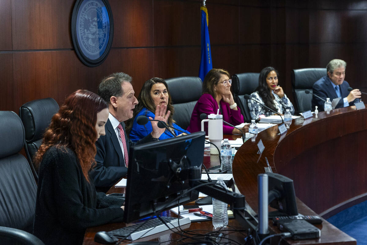 Commissioner Brian Krolicki, left, speaks to members of the Bally's Corporation on hand about t ...