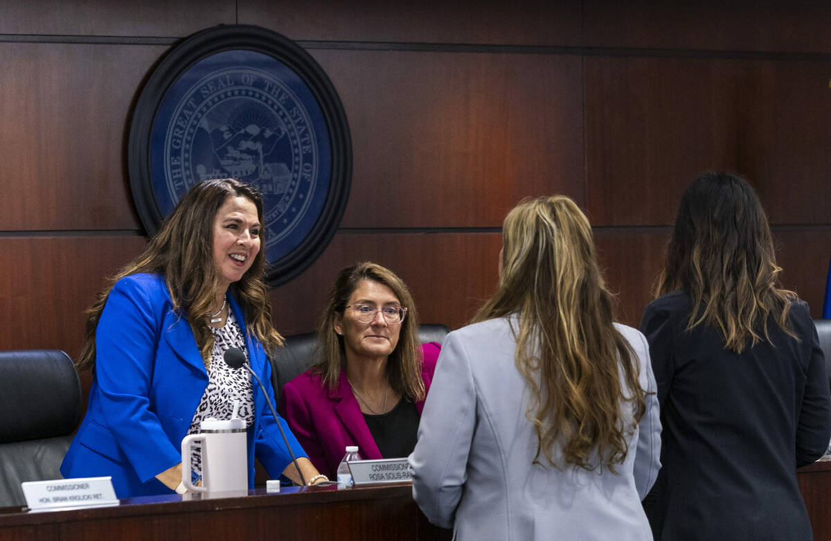 Commissioner Rosa Solis-Rainey, left, with Chair Jennifer Togliatti speak with attendees before ...